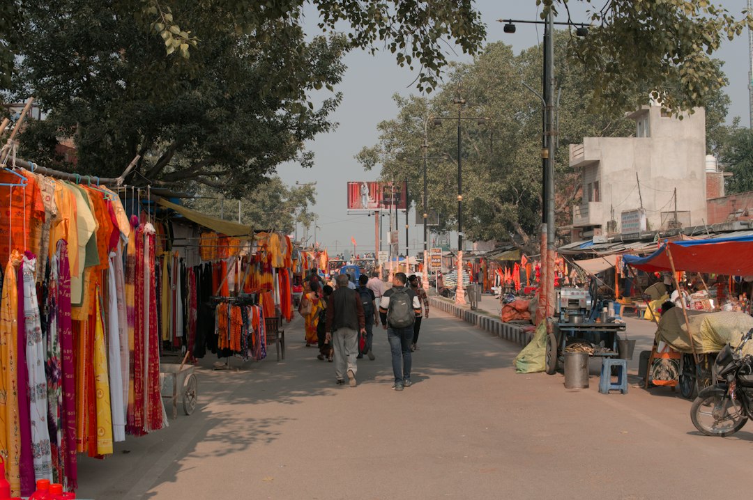 Street lined with clothing stalls in an Indian textile market